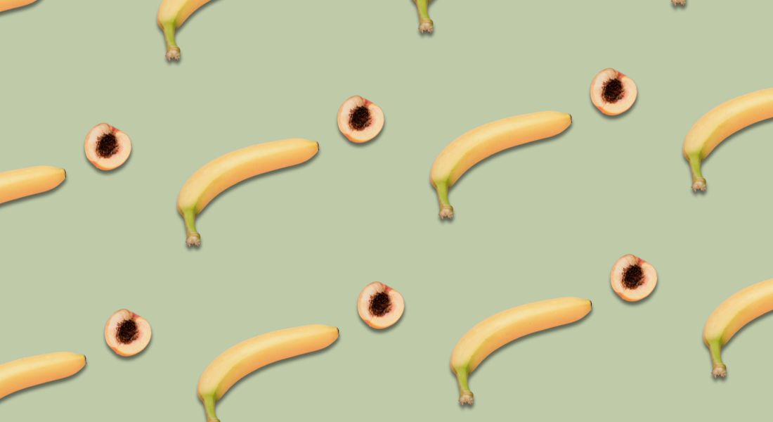 bananas and peaches on a green background